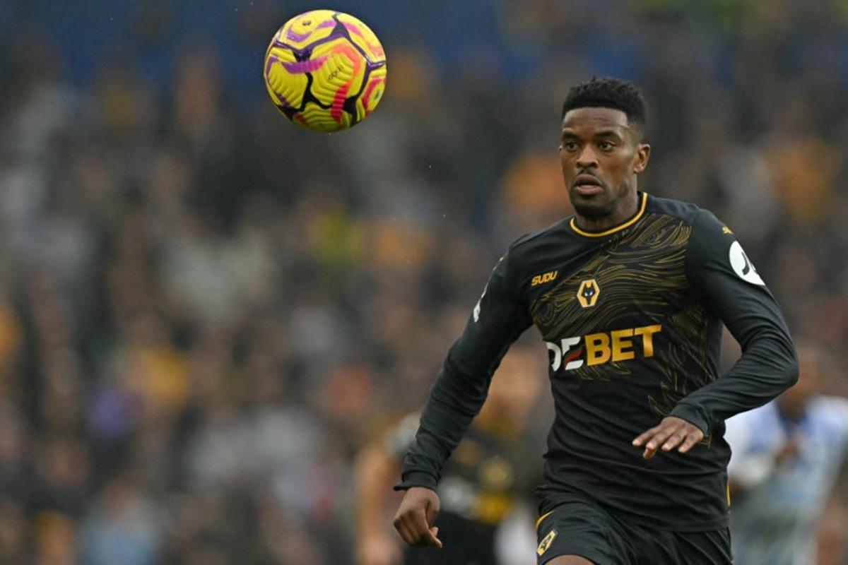 Wolverhampton Wanderers' Portuguese defender #22 Nelson Semedo chases the ball during the English Premier League football match between Brighton and Hove Albion and Wolverhampton Wanderers at the American Express Community Stadium in Brighton, southern England, on October 26, 2024. Glyn KIRK / AFP