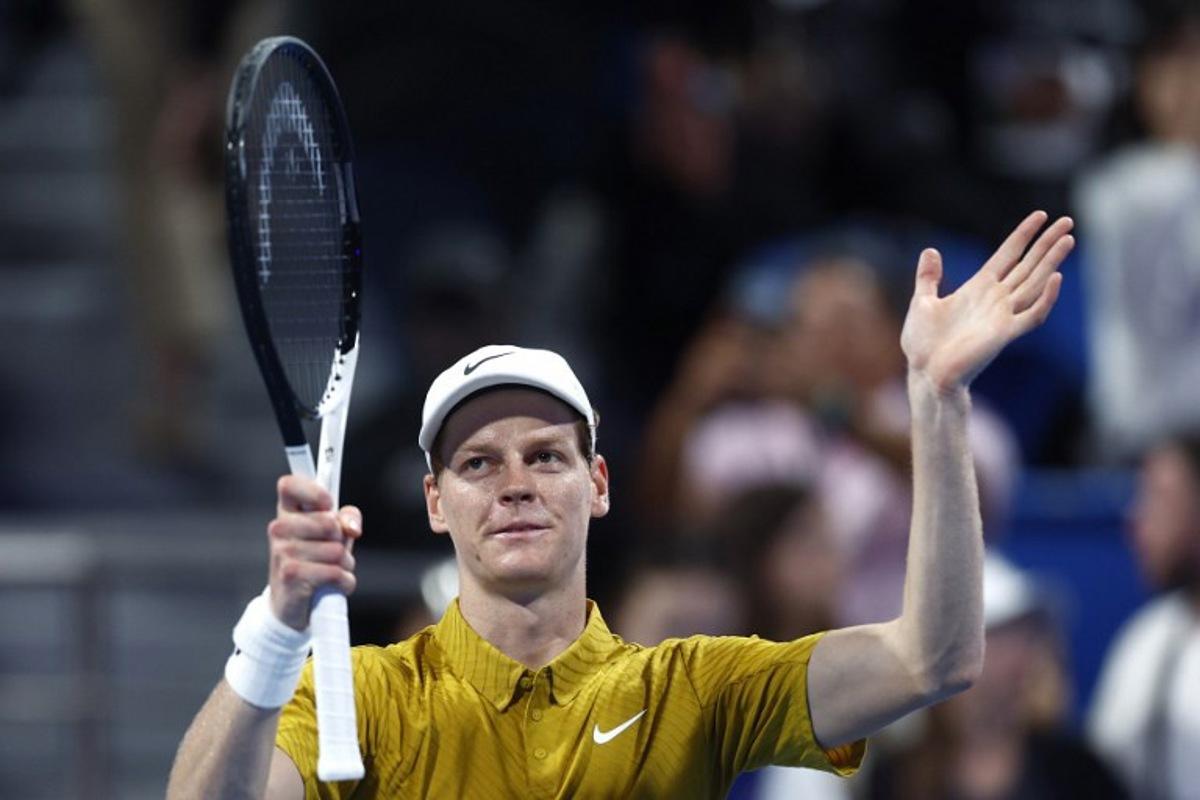 Italy's Jannik Sinner greets the fans after defeating Australia's Alexei Popyrin in their men's singles match at the Qatar Open tennis tournament in Doha on February 18, 2026. Karim JAAFAR / AFP