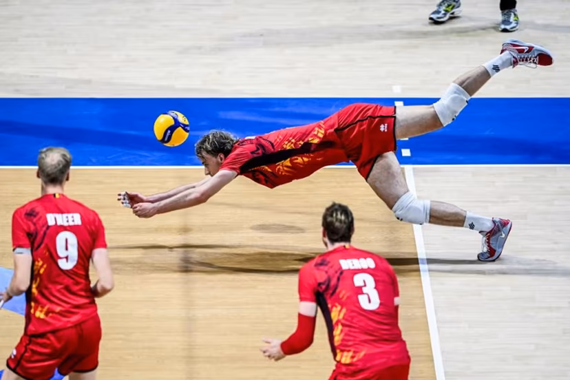 Belgium's Ferre Reggers dives for the ball against Italy during the 2025 Men's Volleyball World Championship at the Araneta Coliseum in Quezon City on September 16, 2025. SHERWIN VARDELEON / AFP