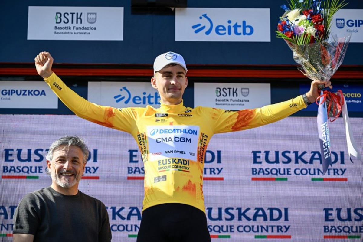 Overall race leader Team Decathlon CMA CGM's French rider Paul Seixas celebrates on the podium following the fourth stage of the Basque Country's Itzulia cycling tour, a 167.2 km race starting and finishing in Galdakao, on April 9, 2026. ANDER GILLENEA / AFP