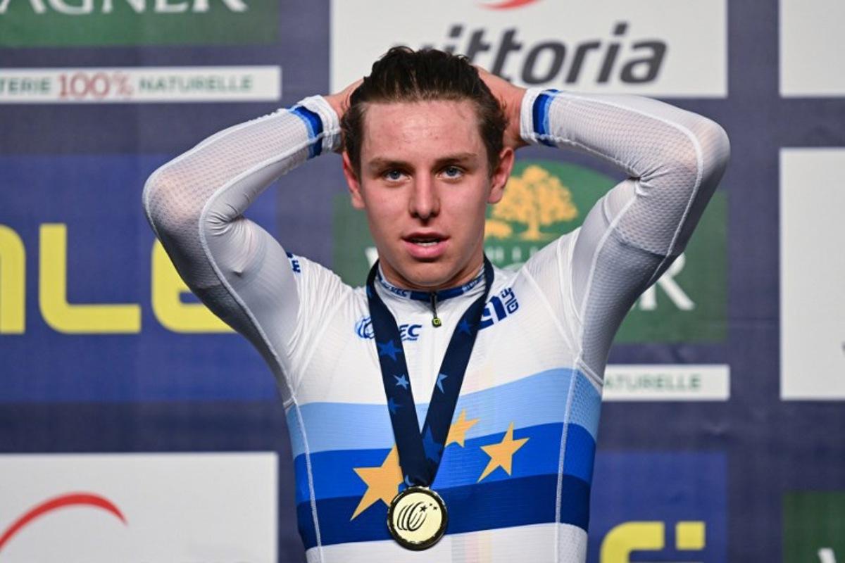Germany's gold medalist TimTorn Teutenberg poses on the podium of the men's elimination race during the UEC Track Elite European Championships in Grenchen on February 8, 2023. SEBASTIEN BOZON / AFP