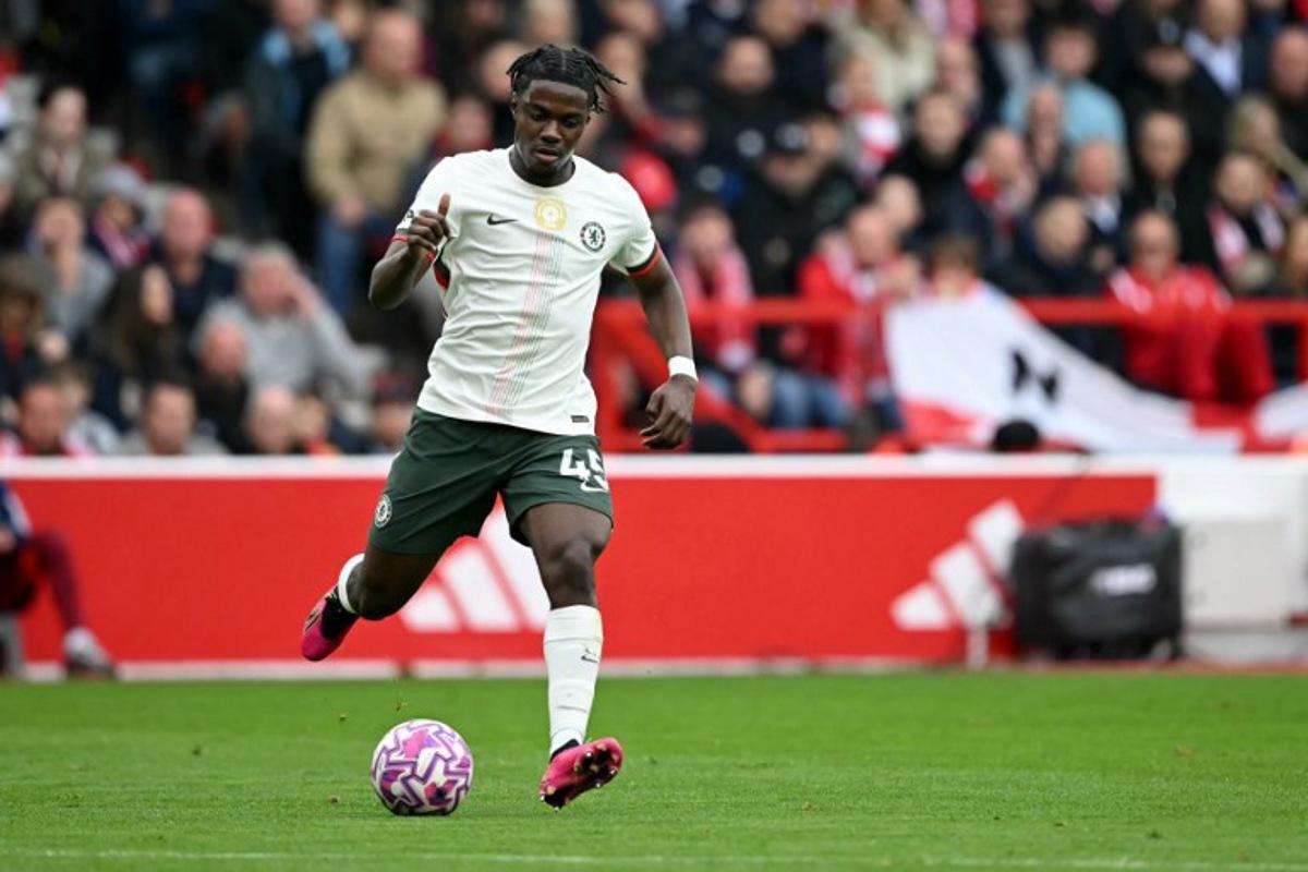 Chelsea's Belgian midfielder #45 Romeo Lavia passes the ball during the English Premier League football match between Nottingham Forest and Chelsea at The City Ground in Nottingham, central England, on October 18, 2025. JUSTIN TALLIS / AFP