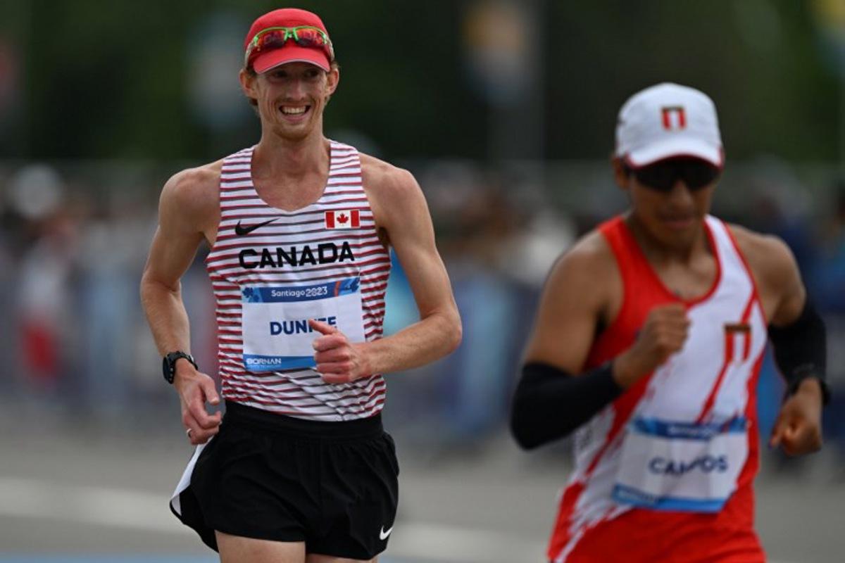 Canada's Evan Dunfee competes in the athletics men's 20km walk race during the Pan American Games Santiago 2023 in Santiago, on October 29, 2023. MAURO PIMENTEL / AFP