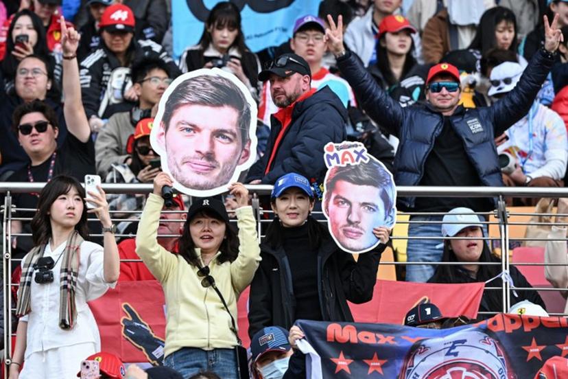Supporters cheers with cut-outs of Red Bull Racing's Dutch driver Max Verstappen prior to the Formula One Chinese Grand Prix at the Shanghai International Circuit in Shanghai on March 15, 2026. Greg Baker / AFP