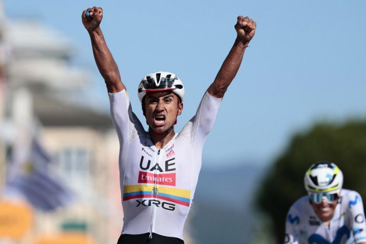 UAE Team Emirates - XRG Ecuadorian rider Jhonatan Narvaez crosses the finish line and wins ahead of Movistar Team Spanish rider Enric Mas the 11th stage of the Giro d'Italia 2026 - Tour of Italy cycling race between Porcari and Chiavari, Italy, on May 20, 2026. Luca Bettini / AFP