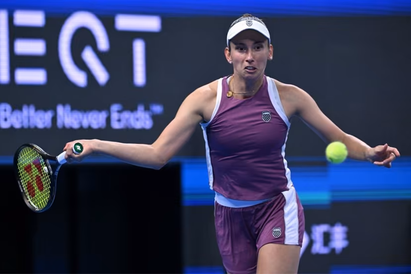 Belgium's Elise Martens hits a return to China's Zheng Qinwen during their semi-final match at the China Open tennis tournament in Beijing on October 10, 2026. ADEK BERRY / AFP