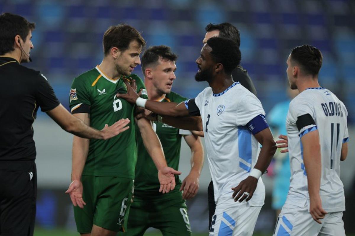 Israel's defender #02 Eli Dasa (CR) pushes Republic of Ireland's midfielder #06 Jayson Molumby (2L) during the UEFA Nations League Group B3 football match between the Republic of Ireland and Israel at the TSC Arena in Backa Topola on October 4, 2026. Pedja Milosavljevic / AFP