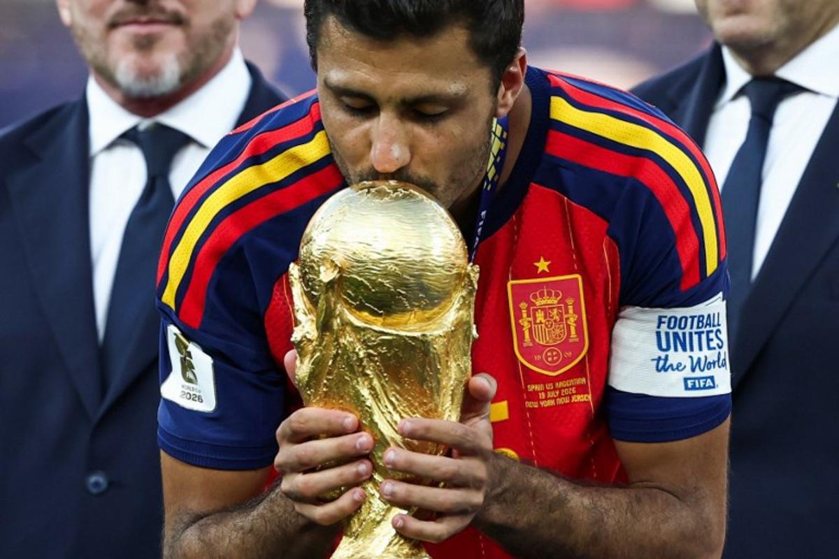 Spain's midfielder #16 Rodri kisses the trophy after winning the 2026 World Cup football tournament final match between Spain and Argentina at the New York/New Jersey Stadium in East Rutherford on July 19, 2026. FRANCK FIFE / AFP