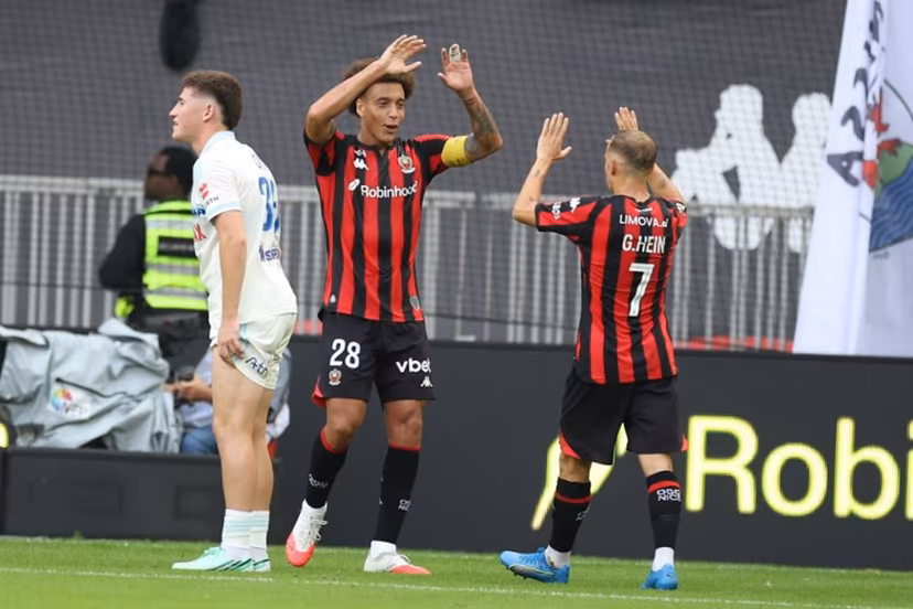 Nice's French forward #07 Gauthier Hein (R) celebrates with Nice's Belgian midfielder #28 Axel Witsel (L) after scoring a goal during the French L1 football match between OGC Nice and RC Strasbourg Alsace at the Allianz Riviera Stadium in Nice on October 11, 2026. Valery HACHE / AFP