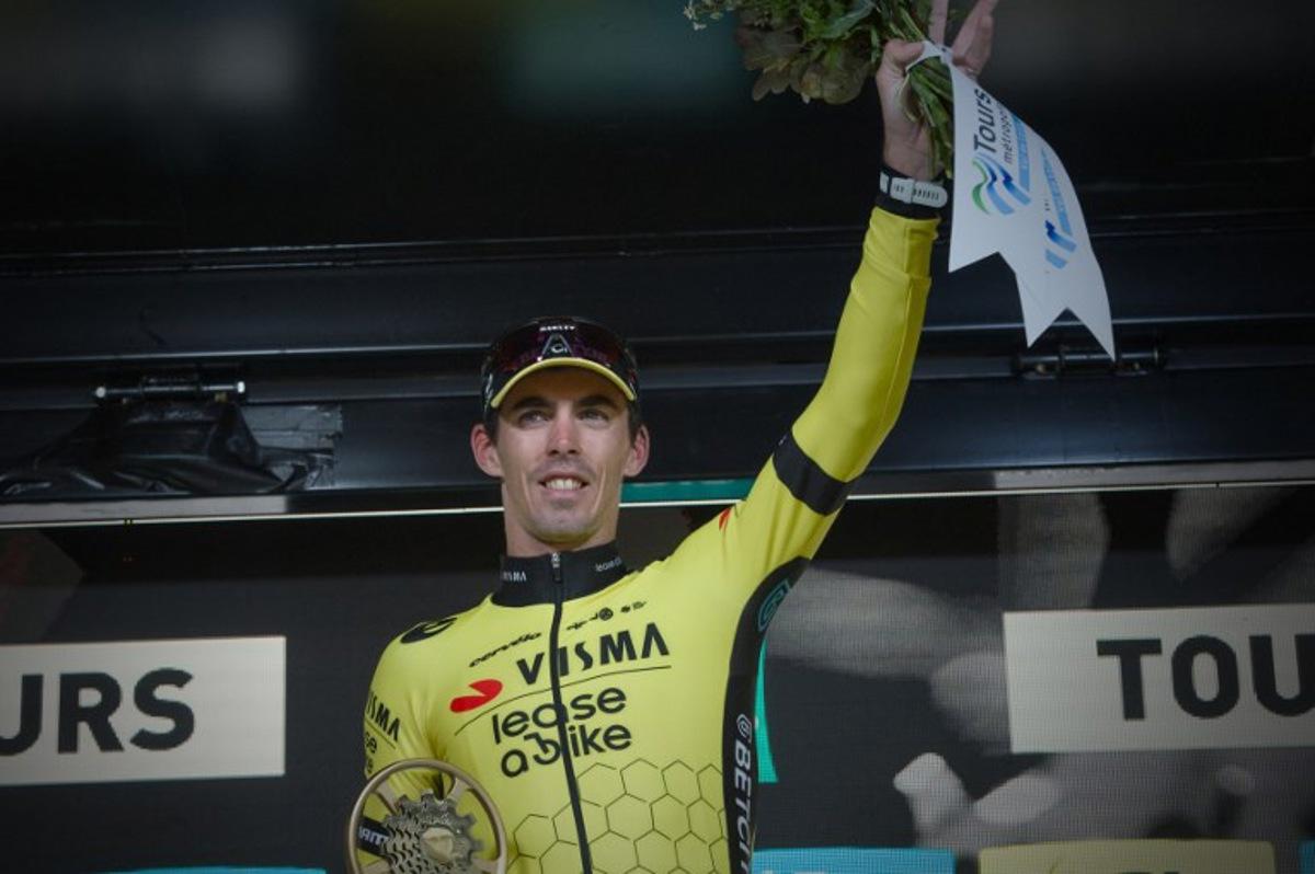French rider of team Visma Lease A Bike Christophe Laporte celebrates on the podium after he won the 118th edition of the 213,9 km Paris-Tours one day cycling race, in Tours, central France on October 6, 2024. GUILLAUME SOUVANT / AFP