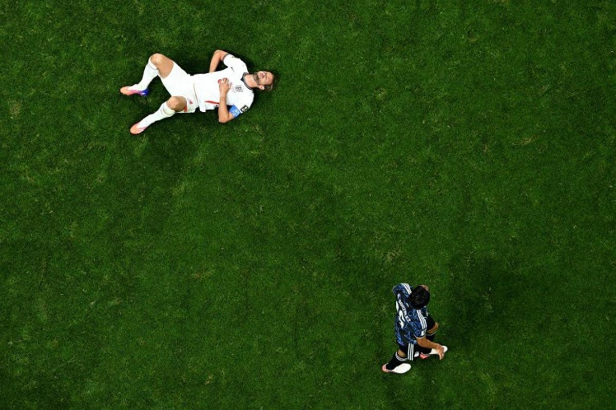England's forward #09 Harry Kane lies on the pitch during the 2026 World Cup football tournament semi-final match between England and Argentina at the Atlanta Stadium in Atlanta on July 15, 2026. Jewel SAMAD / AFP