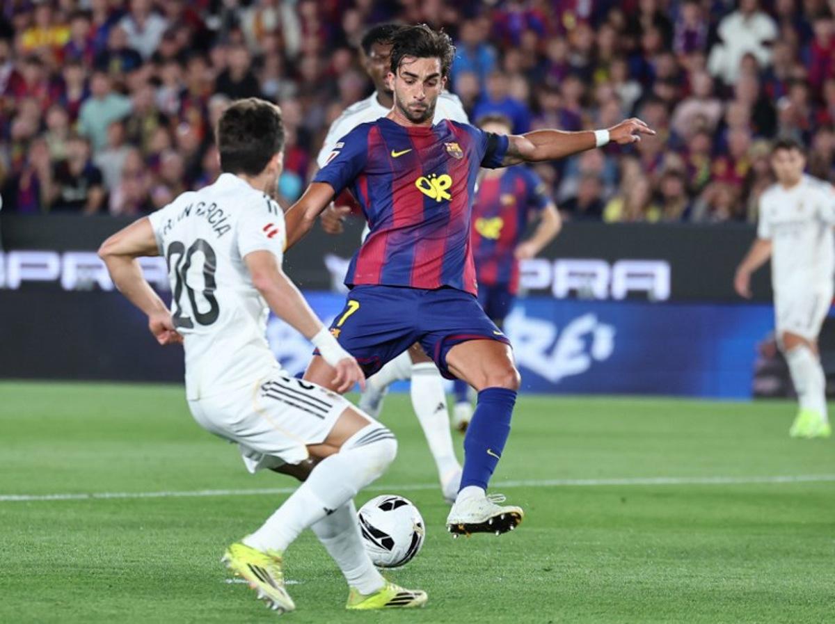 Barcelona's Spanish forward #07 Ferran Torres scores his team's second goal during the Spanish league football match between FC Barcelona and Real Madrid CF at Camp Nou Stadium in Barcelona on May 10, 2026. Josep LAGO / AFP