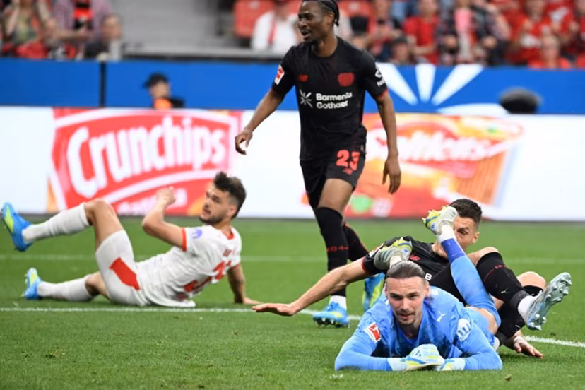 Bayer Leverkusen's Czech forward #14 Patrik Schick (R) reacts after scoring the 1-0 during the German first division Bundesliga football match between Bayer 04 Leverkusen and RB Leipzig in Leverkusen, western Germany, on May 2, 2026. UWE KRAFT / AFP