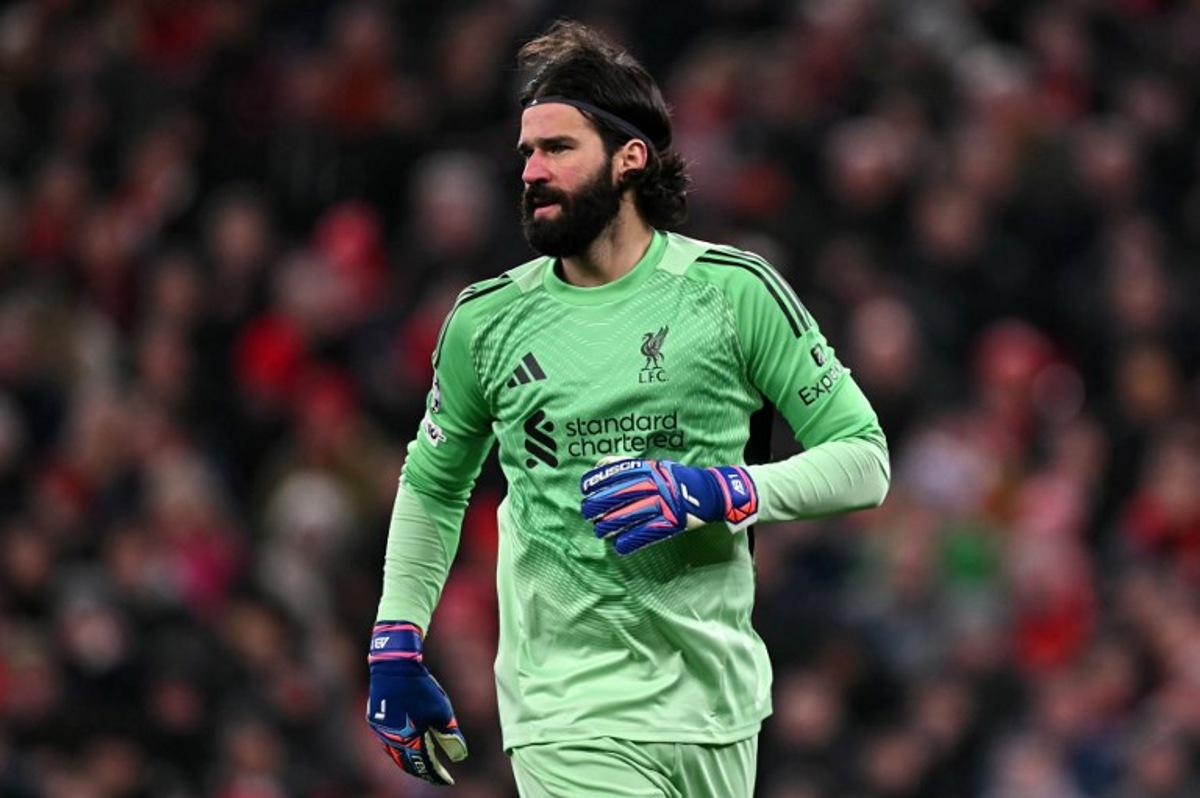 Liverpool's Brazilian goalkeeper #01 Alisson Becker looks on during the UEFA Champions League football match between Liverpool and Qarabag at Anfield in Liverpool, north west England on January 28, 2026. Paul ELLIS / AFP