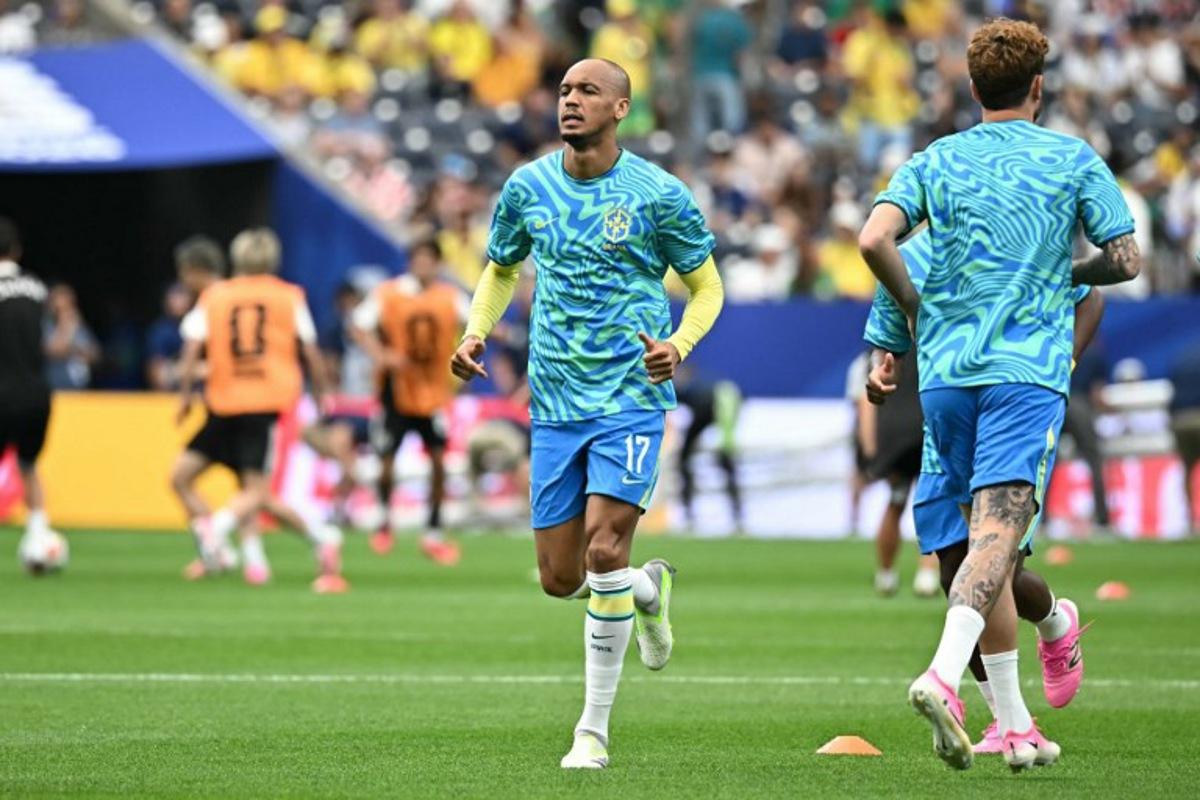 Brazil's midfielder #17 Fabinho warms up prior to the 2026 World Cup round of 32 football match between Brazil and Japan at the Houston Stadium in Houston on June 29, 2026. Paul ELLIS / AFP