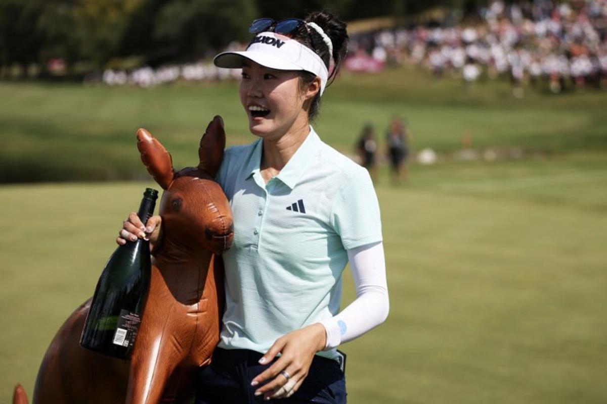 Australia's Grace Kim celebrates after victory on the first playoff hole after the final round of the Amundi Evian Championship at Evian Resort Golf Club, in Evian-Les-Bains, eastern France on July 13, 2025. Alex MARTIN / AFP
