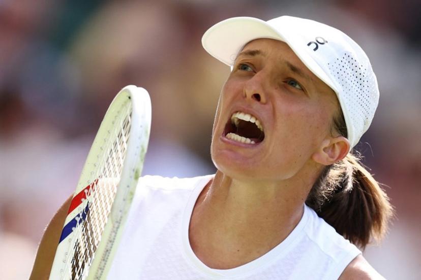 Poland's Iga Swiatek celebratres breating US player Taylor Townsend during their women's singles first round tennis match on the second day of the 2026 Wimbledon Championships at The All England Lawn Tennis and Croquet Club in Wimbledon, southwest London, on June 30, 2026. Henry Nicholls / AFP