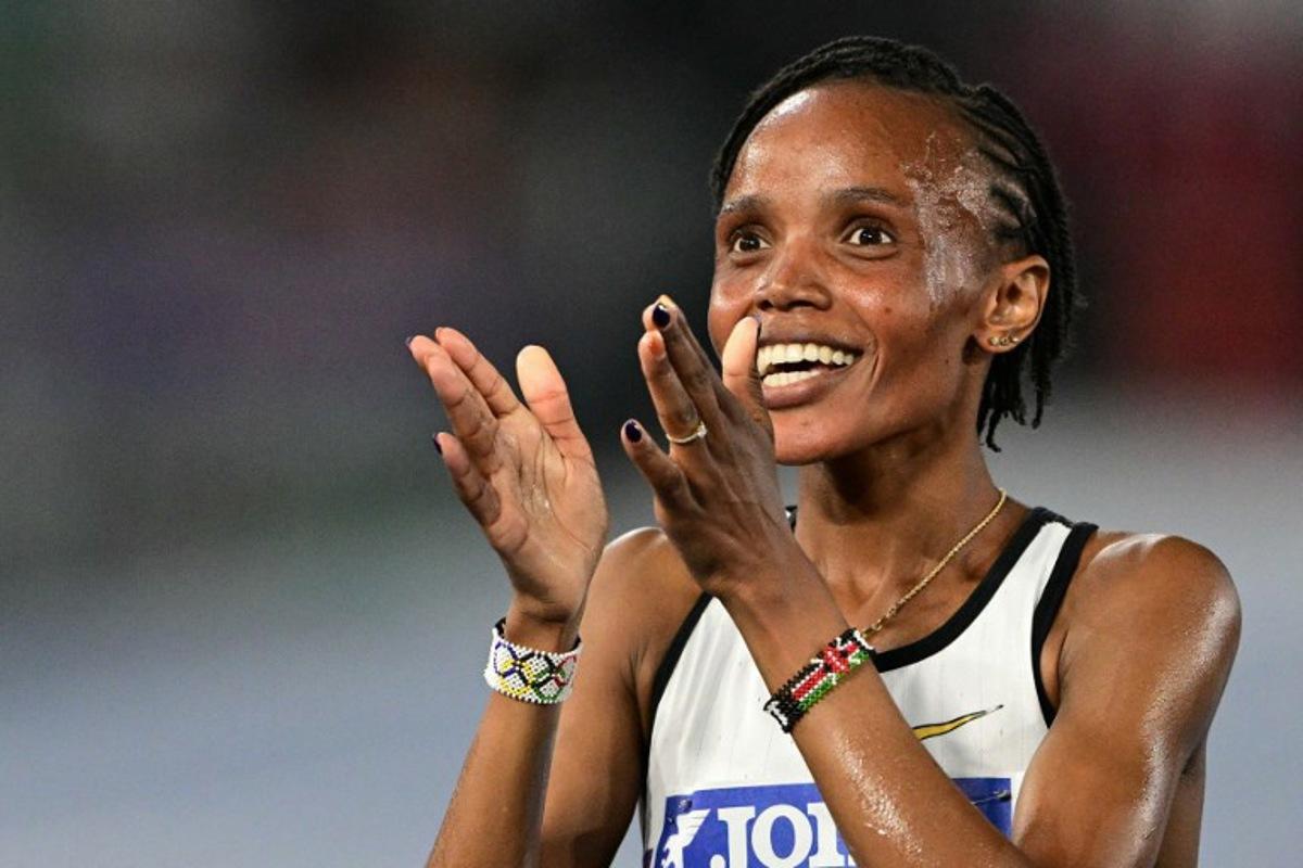 Kenya's Beatrice Chebet celebrates after winning the women's 5000m event of the Diamond League athletics meeting at the Olympic stadium in Rome on June 6, 2025. Tiziana FABI / AFP