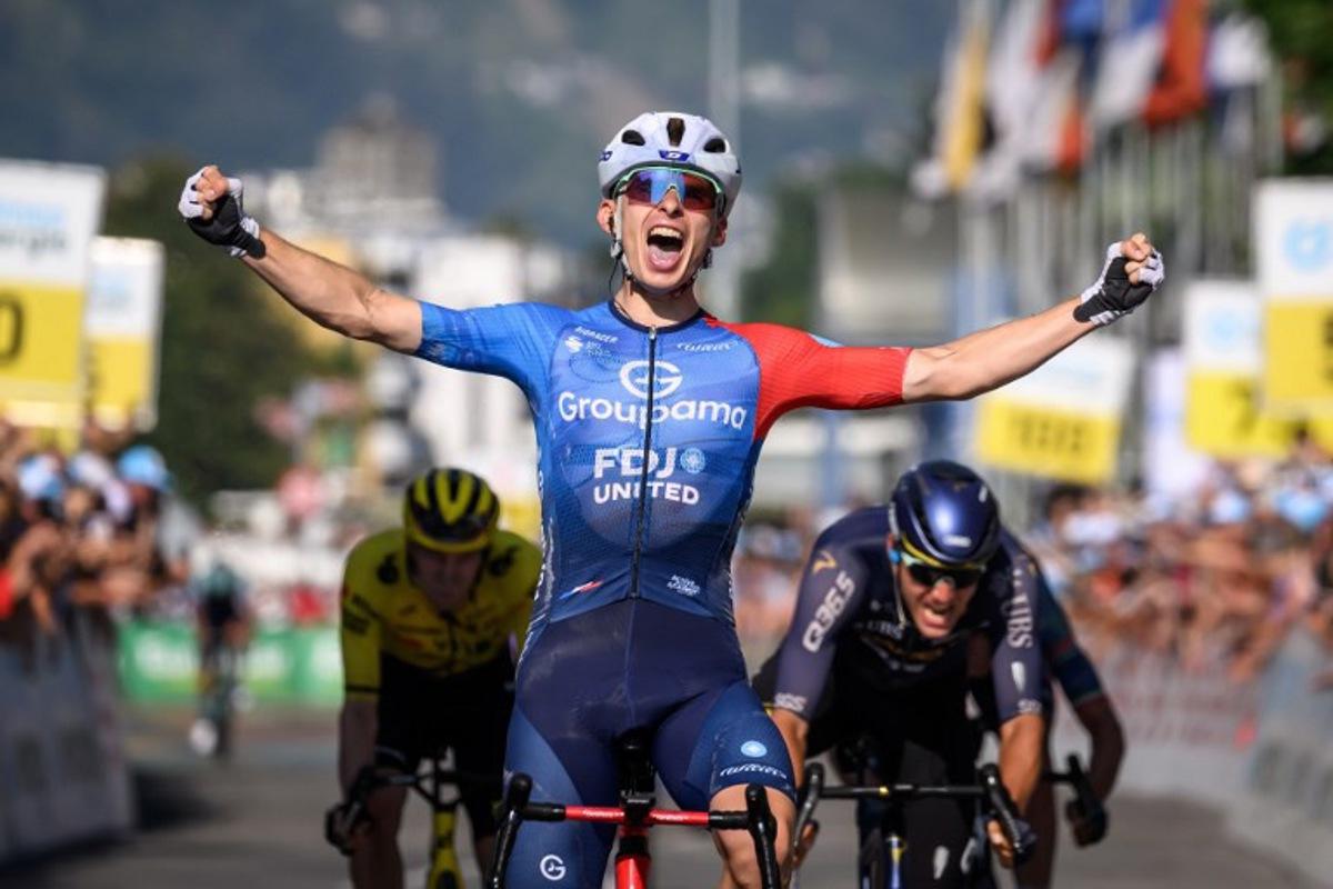 Groupama-FDJ's French rider Romain Gregoire celebrates as he crosses the finish line to win the second stage 157,7km from Locarno to Locarno at the Men's Tour of Switzerland (Tour de Suisse) cycling race in Locarno, Switzerland, on June 18, 2026. Fabrice COFFRINI / AFP