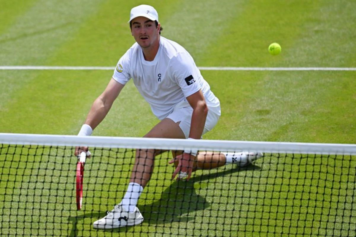 Brazil's Joao Fonseca returns to Russia's Roman Safiullin during their men's singles third round tennis match on the fifth day of the 2026 Wimbledon Championships at The All England Lawn Tennis and Croquet Club in Wimbledon, southwest London, on July 3, 2026. Kirill KUDRYAVTSEV / AFP