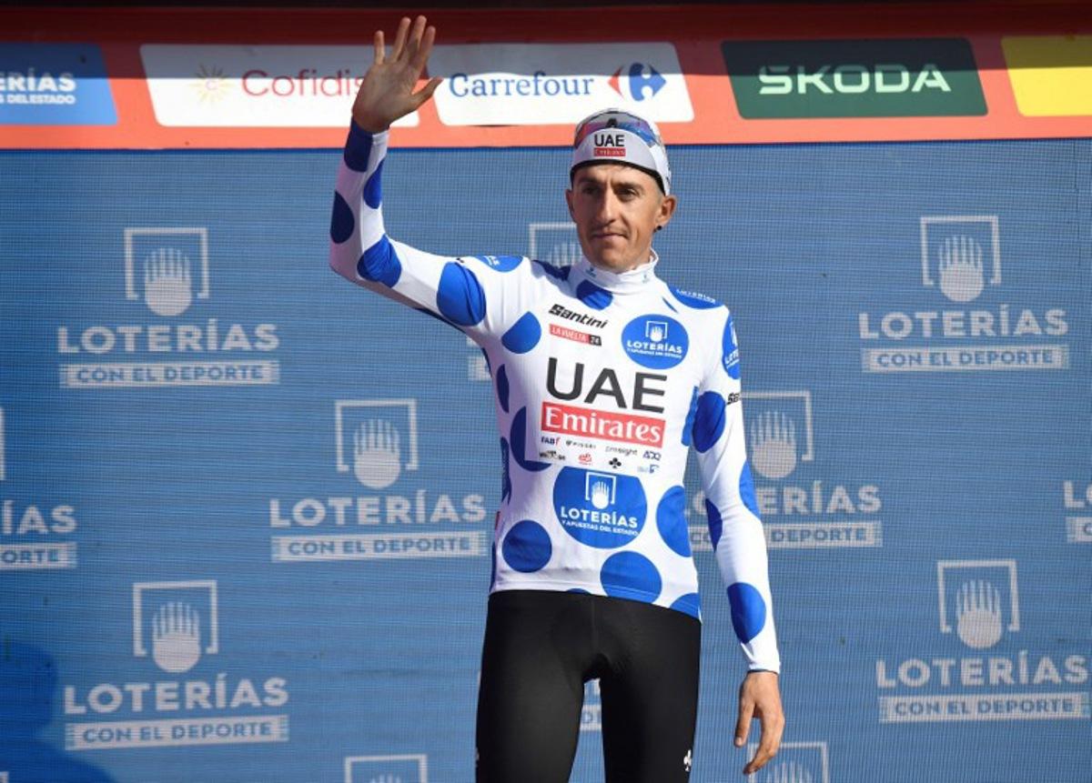 Team UAE's Marc Soler wearing the climber ranking leader celebrates on the podium after the stage 19 of the Vuelta a Espana, a 173,5 km race between Logrono and Alto de Moncalvillo, on September 6, 2024. ANDER GILLENEA / AFP