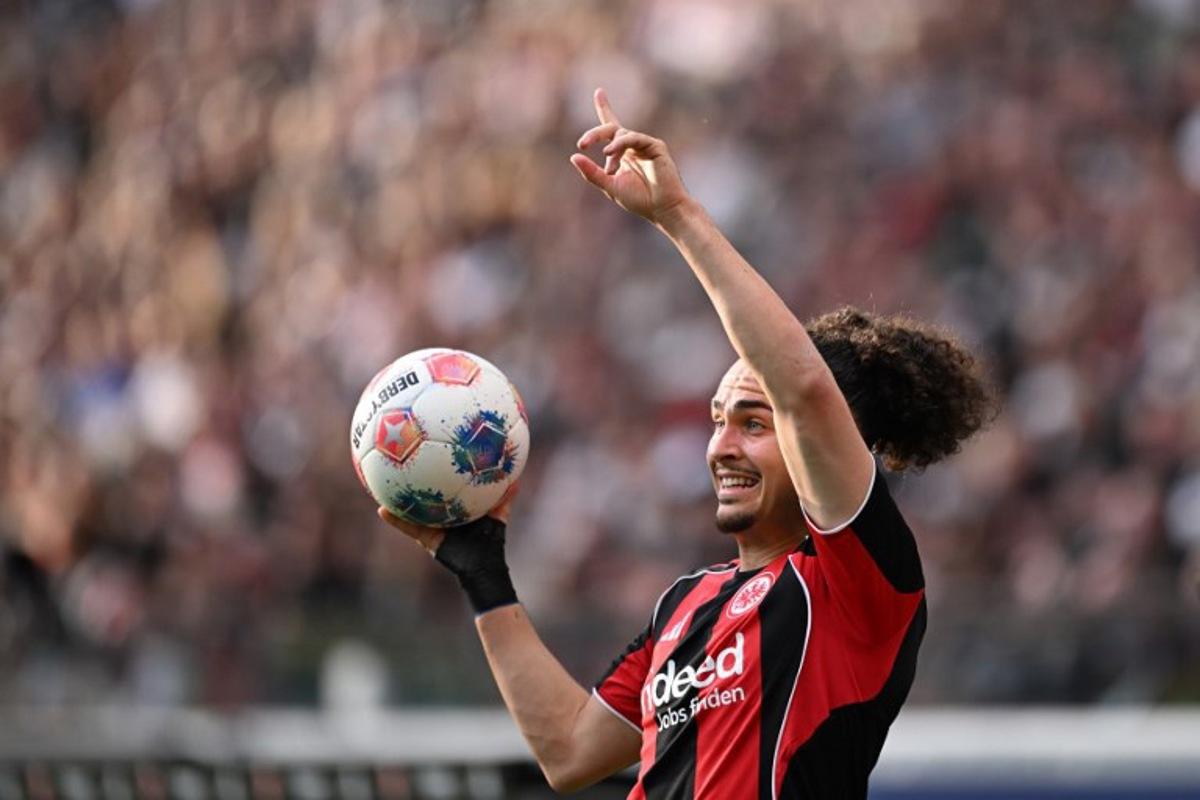 Frankfurt's Belgian defender #03 Arthur Theate gestures with the ball during the German first division Bundesliga football match between Eintracht Frankfurt and RB Leipzig in Frankfurt am Main, western Germany, on April 18, 2026. Kirill KUDRYAVTSEV / AFP