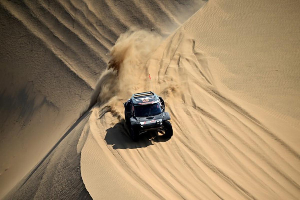 The Dacia Sandriders's Qatari driver Nasser Al-Attiyah and Belgian co-pilot Fabian Lurquin compete in Stage 10 of the 48th edition of the Dakar Rally 2026, between Bisha and Bisha, Saudi Arabia, on January 14, 2026. Giuseppe CACACE / AFP