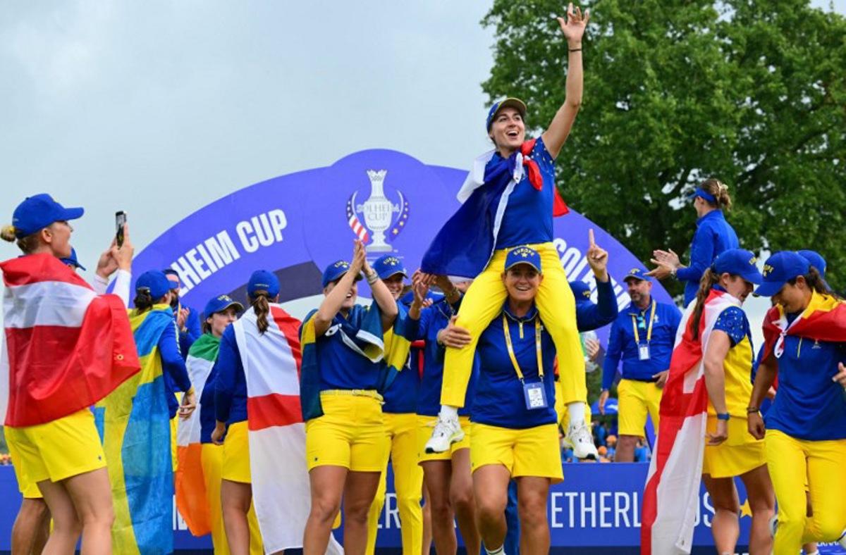 Team Europe's players including French golfer Nastasia Nadaud (C) celebrate with the trophy after victory on the final day of the 2026 Solheim Cup biennial team golf competition on The Bernardus Golf Course at Cromvoirt, some 80kms south-east of Rotterdam on September 13, 2026. NICOLAS TUCAT / AFP