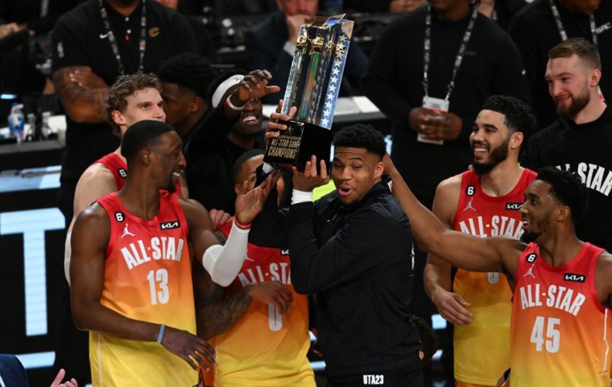 Milwaukee Bucks' Giannis Antetokounmpo lift the trophy after his team won the NBA All-Star game between Team Giannis and Team LeBron at the Vivint arena in Salt Lake City, Utah, February 19, 2023. Patrick T. Fallon / AFP