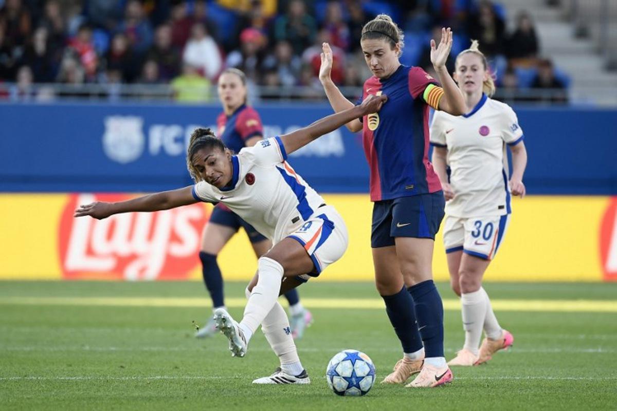 Chelsea's US forward #09 Catarina Macario (L) vies for the ball with Barcelona's Spanish midfielder #11 Alexia Putellas during the UEFA Women's Champions League semi-final first leg football match between FC Barcelona and Chelsea at the Johan Cruyff stadium in Barcelona, on April 20, 2025. Josep LAGO / AFP
