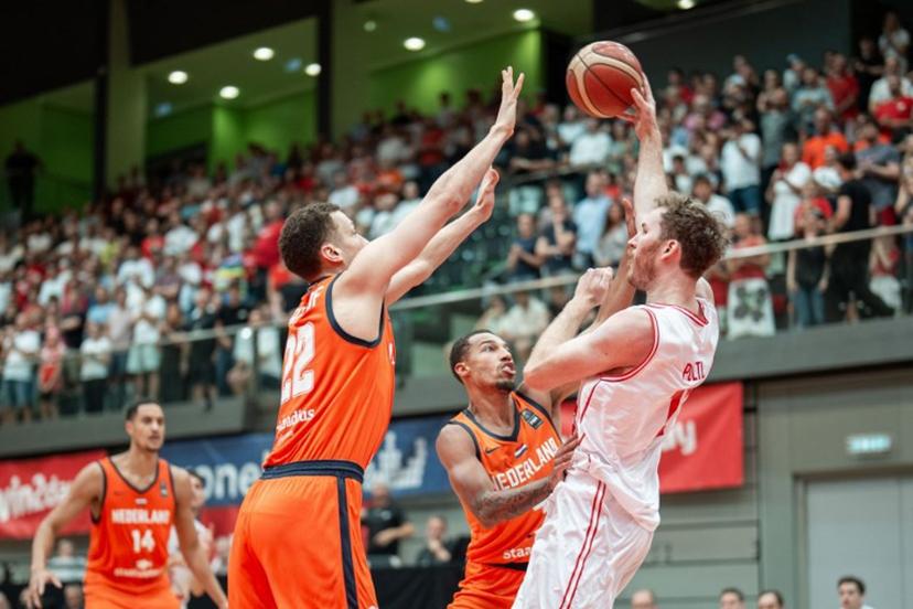 Netherlands' Jesse Edwards, Lucas Kruithof, Jamie Bergens and Austria's Jakob Poltl vie for the ball during pre-qualification match for the 2027 Men's Basketball World Cup between Austria and the Netherlands in Schwechat, Austria, on August 13, 2025. GEORG HOCHMUTH / APA / AFP