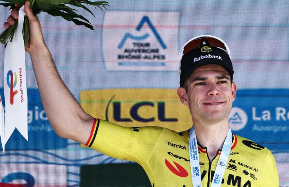 Stage winner Team Visma | Lease a Bike's Belgian rider Wout Van Aert celebrates on the podium of the 5th stage of the Tour Auvergne-Rhone-Alpes cycling race (formerly known as the Criterium du Dauphine), 195,8km between Saint-Chamond and Villars-les-Dombes, central France, on June 11, 2026. Anne-Christine POUJOULAT / AFP