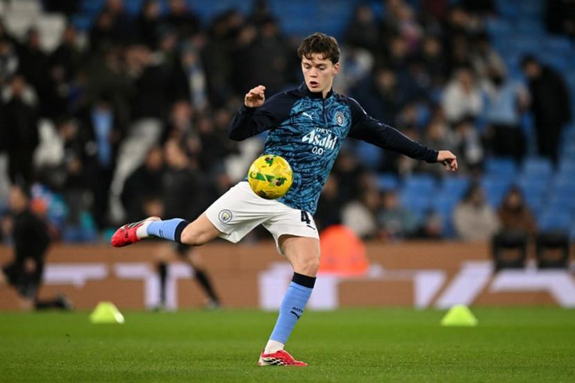 Manchester City's Norwegian midfielder #41 Sverre Nypan warms up ahead of the English League Cup semi final second leg football match between Manchester City and Newcastle United at the Etihad stadium in Manchester, northwest England on February 4, 2026. Oli SCARFF / AFP
