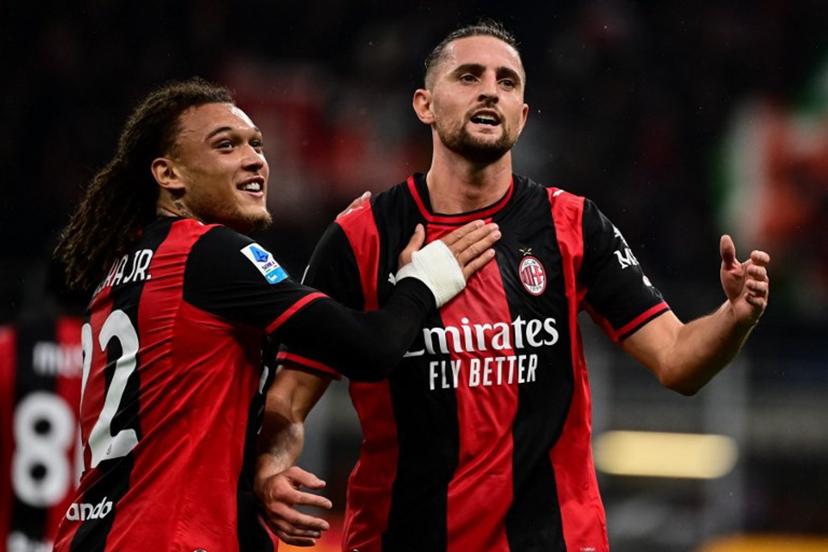 AC Milan's French midfielder #12 Adrien Rabiot (R) celebrates with AC Milan's Belgian midfielder #22 Diego Moreira after scoring his team's second goal during the Italian Serie A football match between AC Milan and Atalanta at the San Siro Stadium in Milan on October 18, 2026. Piero CRUCIATTI / AFP