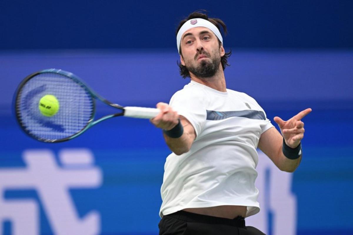 Georgia's Nikoloz Basilashvili hits a return to Spain's Alejandro Davidovich Fokina during their men's singles semi-final match at the Chengdu Open tennis tournament in Chengdu, in China's southwest Sichuan province on September 28, 2026. AFP