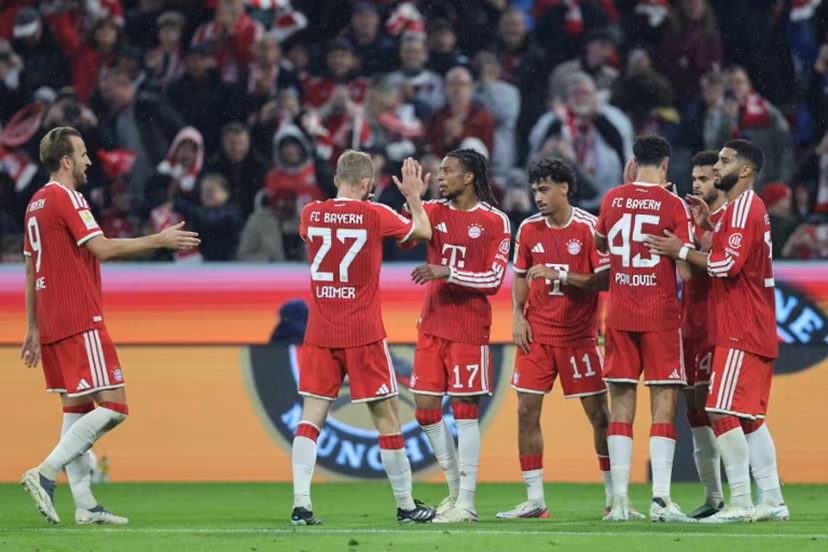 Bayern Munich's French midfielder #17 Michael Olise (3rd L) celebrates scoring the 3-0 goal with his teammates during the German first division Bundesliga football match between FC Bayern Munich and RB Leipzig in Munich, southern Germany, on October 17, 2026. Alexandra BEIER / AFP