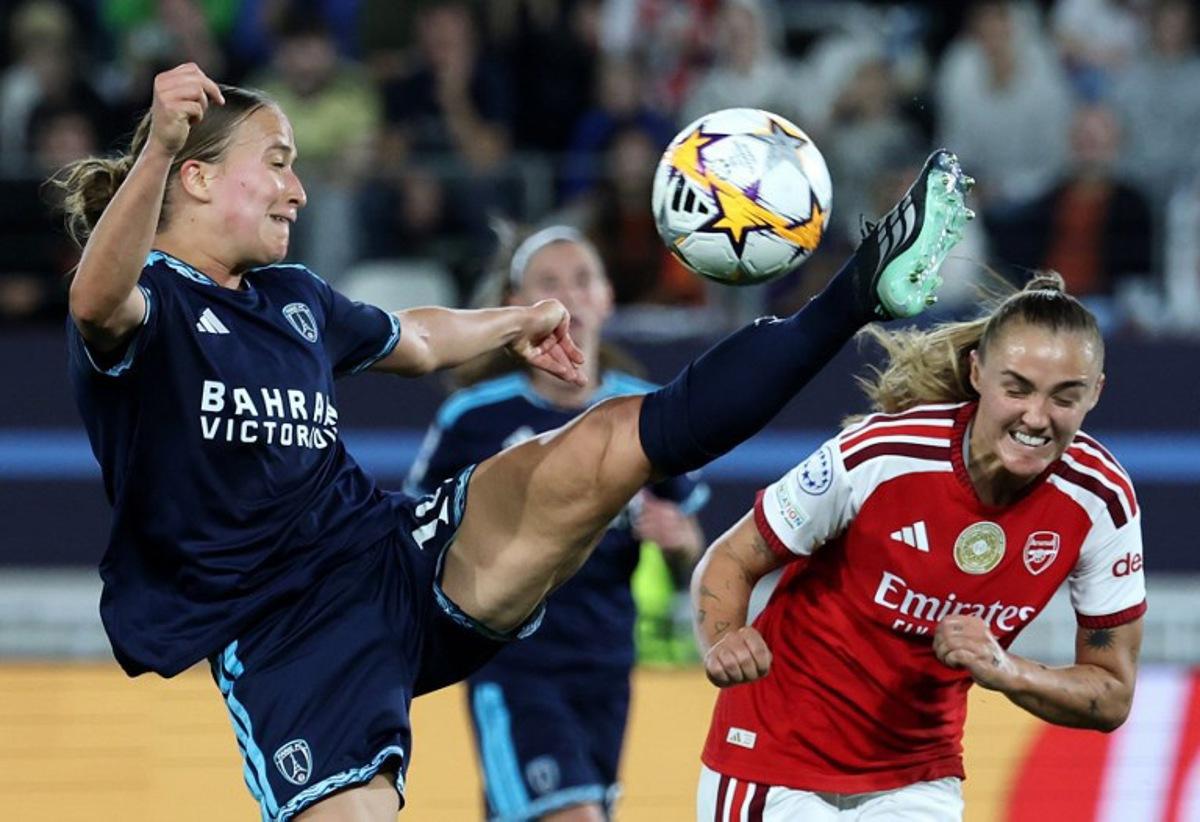 Paris FC's French defender #19 Thea Gheboval (L) and Arsenal's English midfielder #04 Georgia Stanway (r) fight for the ball during the UEFA Women's Champions League league phase Matchday 2 football match between Paris FC and Arsenal WFC at the Jean-Bouin Stadium in Paris on September 30, 2026. FRANCK FIFE / AFP