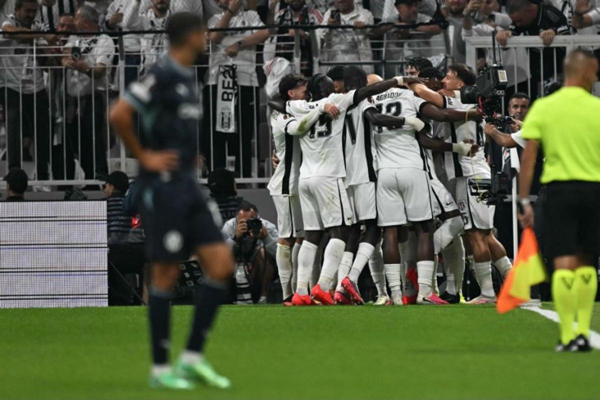 Besiktas' players celebrate their team's first goal during the UEFA Europa League first round 1 day 1 football match between Besiktas and Olympique de Marseille (OM) at Besiktas Tupras Stadium in Istanbul, on September 17, 2026. Ozan KOSE / AFP