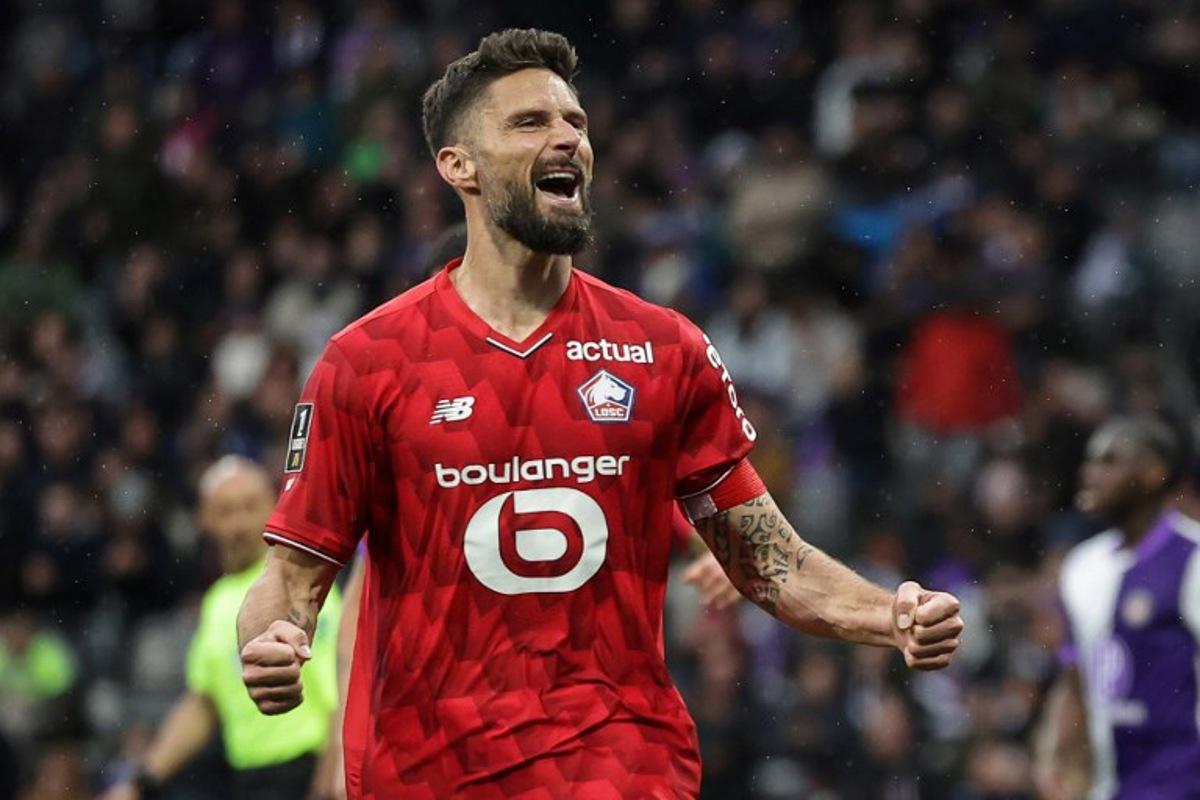 Lille's French forward #09 Olivier Giroud celebrates after scoring during the French L1 football match between Toulouse FC and Lille LOSC at the TFC Stadium in Toulouse, southwestern France, on April 12, 2026. Valentine CHAPUIS / AFP