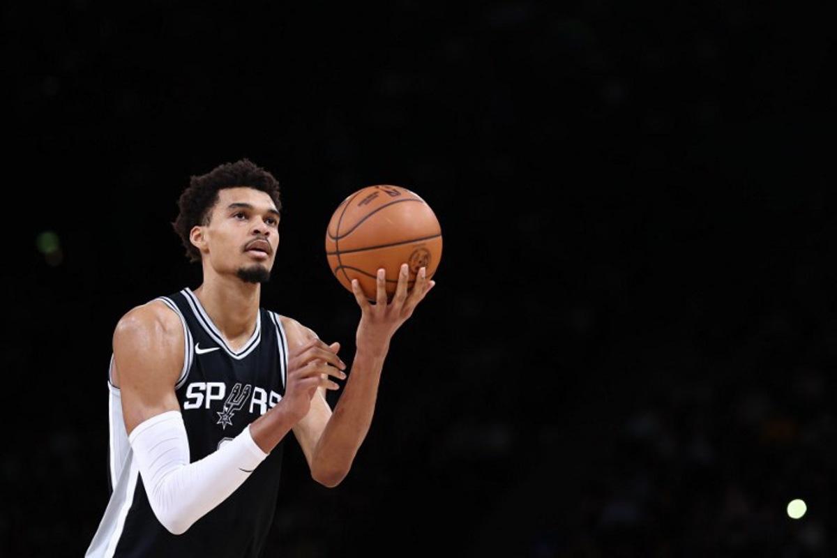 San Antonio Spurs' French forward-center #01 Victor Wembanyama aims a throw during the NBA basketball game between the San Antonio Spurs and the Indiana Pacers at the Accor Arena - Palais Omnisports de Paris-Bercy - in Paris on January 25, 2025. FRANCK FIFE / AFP