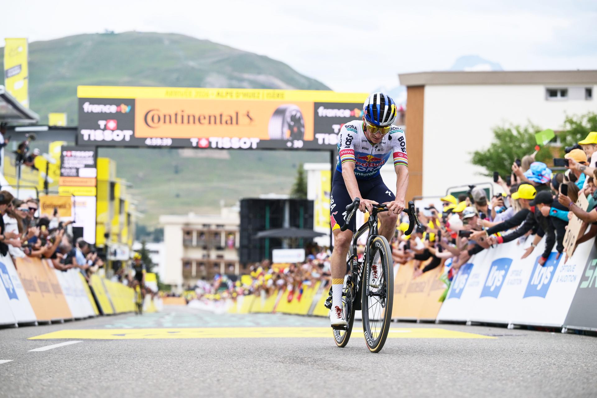 Belgian Remco Evenepoel of Red Bull-BORA-hansgrohe crosses the finish line of stage 20 of the 2026 Tour de France cycling race, a stage of 171km Le Bourg d'Oisans to Alpe d'Huez, on Saturday 25 July 2026. The 113th edition of the Tour de France starts on Saturday 4 July in Barcelona, Spain, and will finish in Paris, France on the 26th of July. BELGA PHOTO DAVID PINTENS