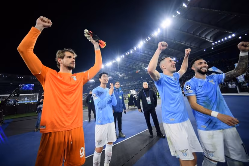 Lazio's Italian goalkeeper #94 Ivan Provedel (L) celebrates with teammates after winning 1-0 the UEFA Champions League last 16 first leg between Lazio and Bayern Munich at the Olympic stadium on February 14, 2024 in Rome. Filippo MONTEFORTE / AFP