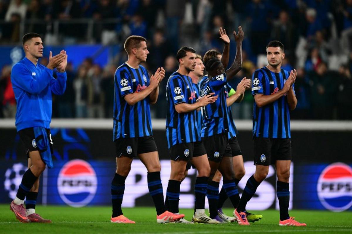 Players celebrate after winning the UEFA Champions League phase day 2 football match between Atalanta and Club Brugge at the Gewiss stadium in Bergamo, on September 30, 2025. Marco BERTORELLO / AFP