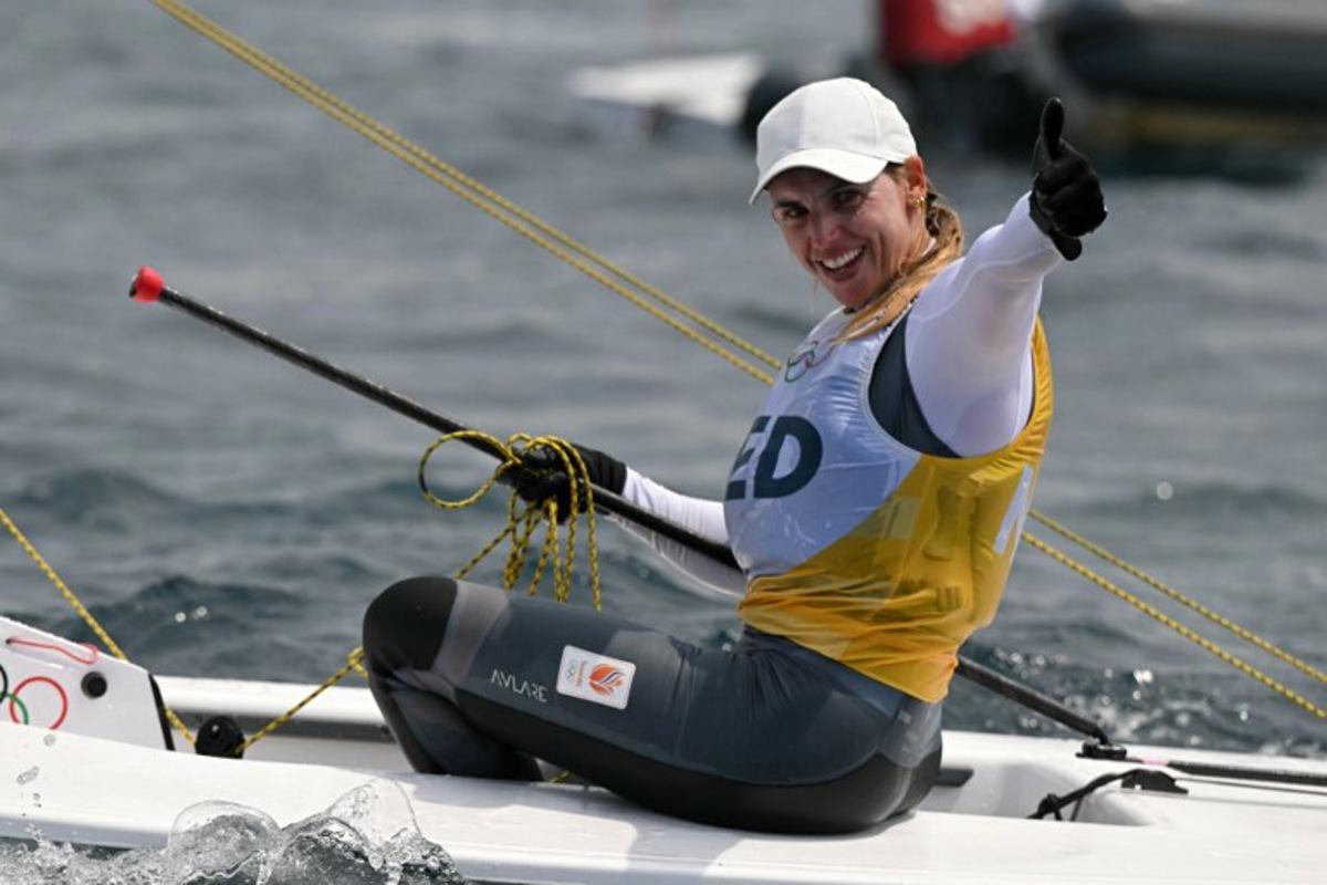 Gold medallist Netherlands' Marit Bouwmeester celebrates at the end of the women's ILCA 6 single-handed dinghy medal race during the Paris 2024 Olympic Games sailing competition at the Roucas-Blanc Marina in Marseille on August 7, 2024. NICOLAS TUCAT / AFP
