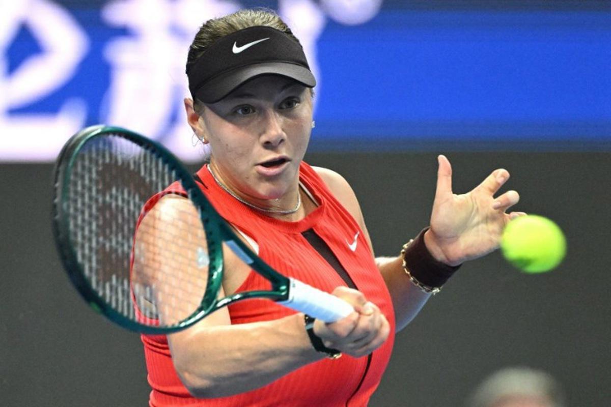 USA's Amanda Anisimova hits a return to Czech Republic's Linda Noskova during the women's singles final at the China Open tennis tournament in Beijing on October 5, 2025. Greg Baker / AFP