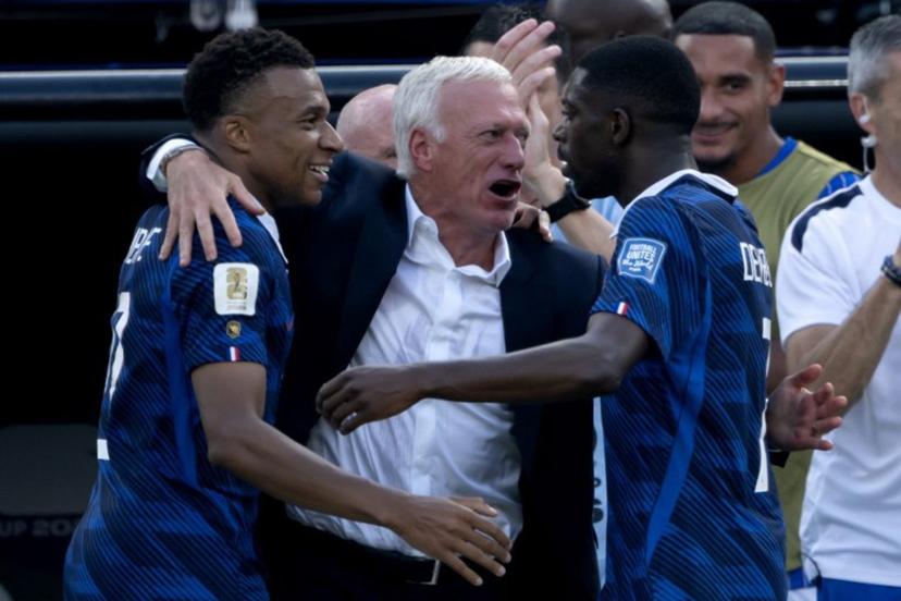 France's head coach Didier Deschamps celebrates with France's forward #10 Kylian Mbappe (L) and France's forward #07 Ousmane Dembele after the team scored the first goal during the 2026 World Cup round of 32 football match between France and Sweden at the New York/New Jersey Stadium in East Rutherford on June 30, 2026. Pedro UGARTE / AFP