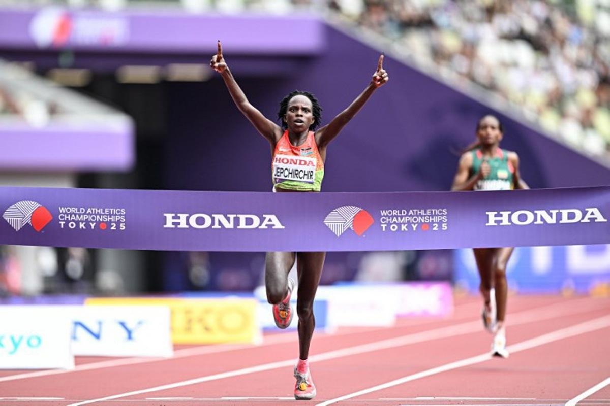 Kenya's Peres Jepchirchir celebrates as she crosses the finish line to win the women's marathon final during the World Athletics Championships in Tokyo on September 14, 2025. Jewel SAMAD / AFP