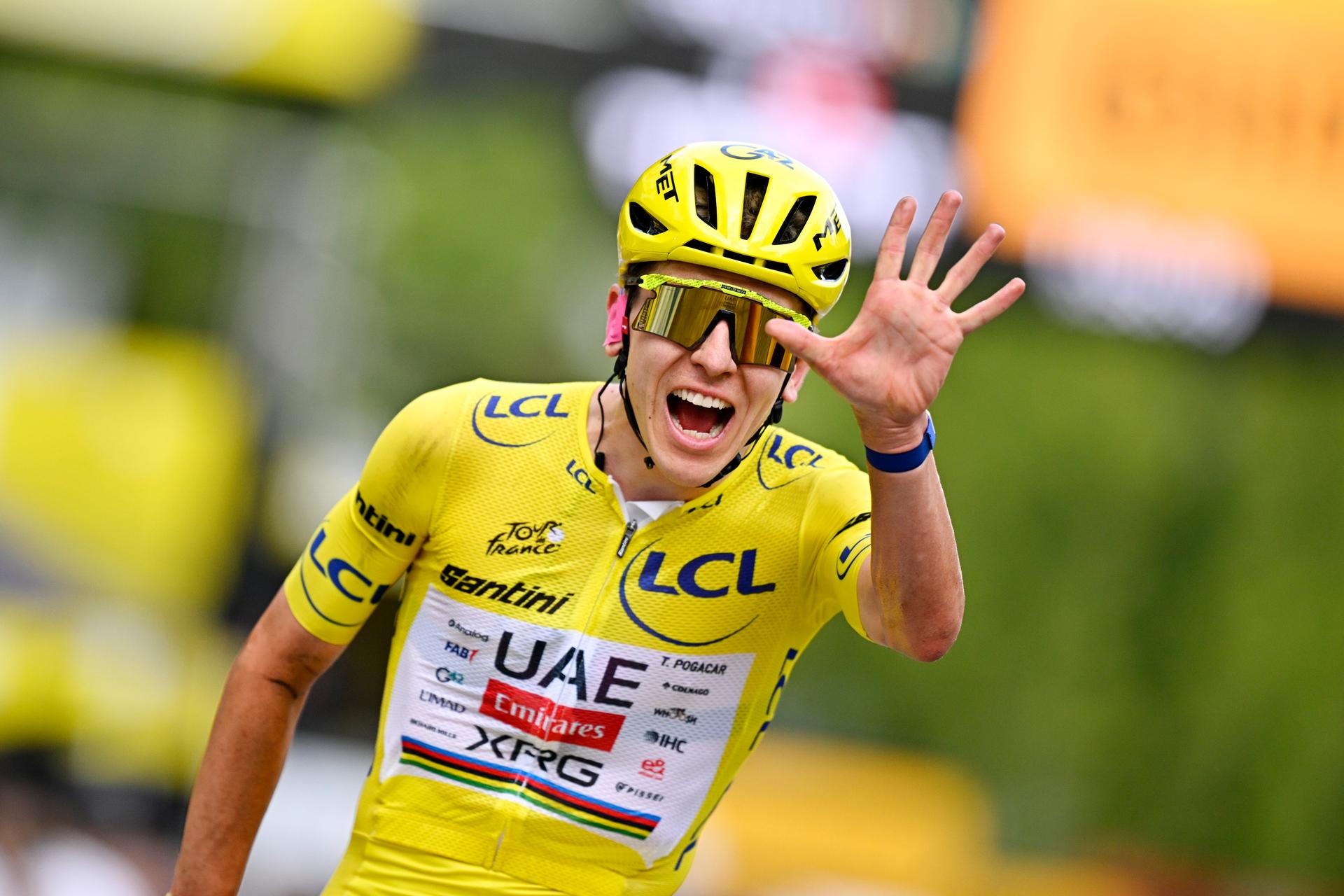 Slovenian Tadej Pogacar of UAE Team Emirates-XRG celebrates as he crosses the finish line at stage 21 of the 2026 Tour de France cycling race, a stage of 130km from Thoiry to Paris Champs-Elysees , on Sunday 26 July 2026. The 113th edition of the Tour de France starts on Saturday 4 July in Barcelona, Spain, and will finish in Paris, France on the 26th of July. BELGA PHOTO JASPER JACOBS