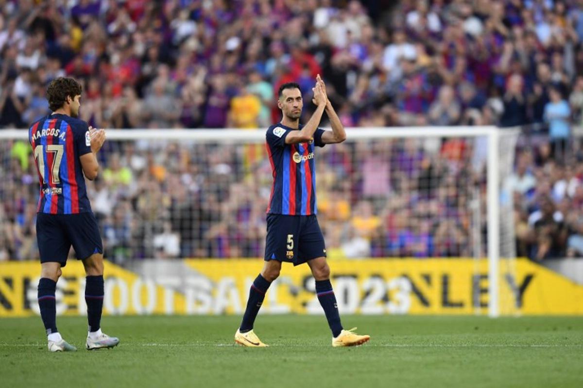 Barcelona's Spanish midfielder Sergio Busquets applauds as he leaves the pitch during the Spanish league football match between FC Barcelona and RCD Mallorca at the Camp Nou stadium in Barcelona on May 28, 2023. Sergio Busquets leaves Barcelona, ending a highly successful era at the club. The 34-year-old was a central figure in Barcelona's golden era winning a host of trophies including the Champions League three times. Pau BARRENA / AFP