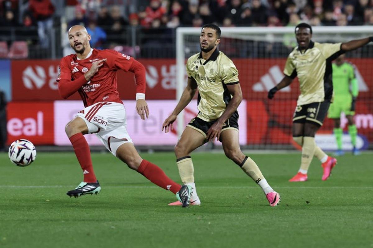 Brest's French forward #19 Ludovic Ajorque (L) fights for the ball with Nice's Egyptian defender #05 Mohamed Abdelmonem during the French L1 football match between Stade Brestois 29 and OGC Nice at the Francis-Le Ble Stadium in Brest, western France on October 23, 2026. Fred TANNEAU / AFP